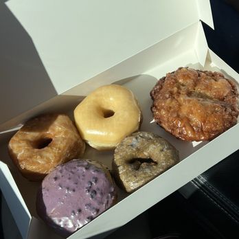 USA Donuts - Cronut, Original glaze (amazing, airy) Blueberry Filled, Blueberry Cake (very moist) Apple Fritter (Nice crust, soft on the inside) - Donuts Near Me - Haltom City, Texas USA Donuts - Cronut, Original glaze (amazing, airy) Blueberry Filled, Blueberry Cake (very moist) Apple Fritter (Nice crust, soft on the inside) - Donuts Near Me - Haltom City, Texas