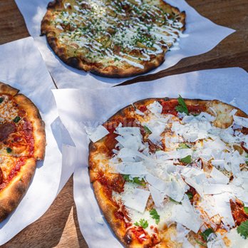 Pizzetta 211 - 3 bad crusts sitting on a table - Pizza Near Me - San Francisco, California Pizzetta 211 - 3 bad crusts sitting on a table - Pizza Near Me - San Francisco, California