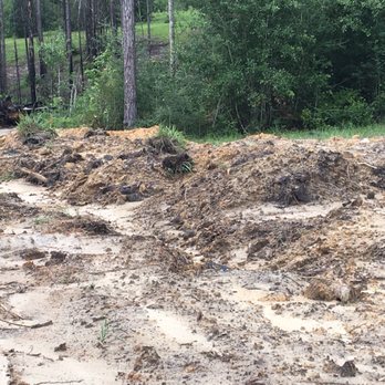 Sun Coast Septic and Drains - Another view of dirt left piled up next to new septic tank - Septic Services Near Me - Kiln, Mississippi
