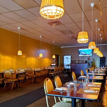 Nellai Banana Leaf - a dining room with tables and chairs - Indian Near Me - Williamsville, New York Nellai Banana Leaf - a dining room with tables and chairs - Indian Near Me - Williamsville, New York