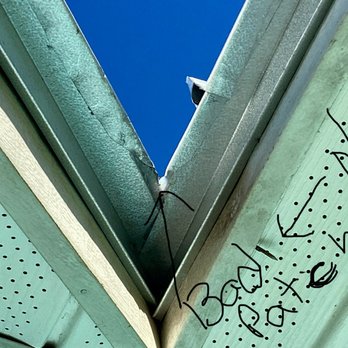 Superior One Roofing - Crew couldn't cut the metal for corners so patched it with clear caulking and spray paint to match . - Roofing Near Me - Palm Bay, Florida