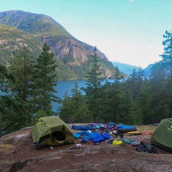 Outdoors Geek - Tents and sleeping bags set up with mountain/ lake background. - Outdoor Gear Near Me - Denver, Colorado Outdoors Geek - Tents and sleeping bags set up with mountain/ lake background. - Outdoor Gear Near Me - Denver, Colorado