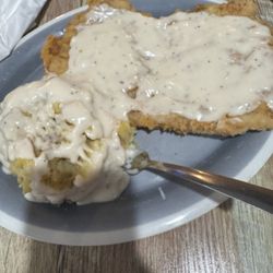 King's Crossing - Open face tenderloin mashed potatoes with country gravy.