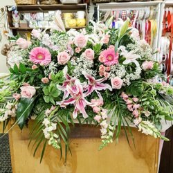 Price's Flowers & Gifts - Pale pink and white casket piece.