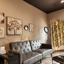Ultima Hair Designers Salon & Spa - A tranquil waiting area awaits you complete with a charging area, wifi, lemon water and coffee.
