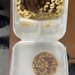 Brisket and Pork Belly Burnt ends with sides of Mac-N-Cheese and Street corn