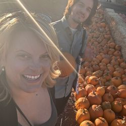Pumpkin Patch at Webb Ranch - Two friends, a ray of sunshine and orange medium size pumpkins