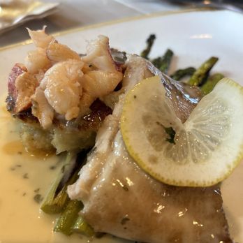 Monkeypod Kitchen by Merriman - Monchong filet with risotto cakes covered with lobster, served on top of beurre blanc sauce and wood fire oven roasted asparagus. - New American Near Me - Kihei, Hawaii Monkeypod Kitchen by Merriman - Monchong filet with risotto cakes covered with lobster, served on top of beurre blanc sauce and wood fire oven roasted asparagus. - New American Near Me - Kihei, Hawaii