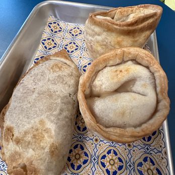 Criollas Hell's Kitchen - two pastries on a tray - Empanadas Near Me - New York, New York