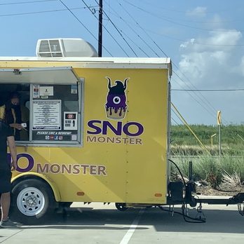 Sno Monster - a man standing in front of a food truck - Food Trucks Near Me
