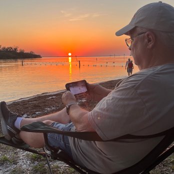 Anclote River Park - Husband watching Lightning hockey game AND sunset! - Parks Near Me - Holiday, Florida Anclote River Park - Husband watching Lightning hockey game AND sunset! - Parks Near Me - Holiday, Florida