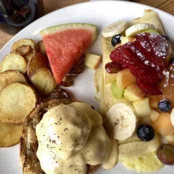 Chez Francois Restaurant - Combo egg bene with duck confit and crepe with fresh fruits - French Near Me - Canmore, Alberta Chez Francois Restaurant - Combo egg bene with duck confit and crepe with fresh fruits - French Near Me - Canmore, Alberta