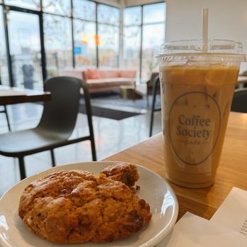 Coffee Society Cafe - Iced Toffee Crunch Latte with Oat Milk and a Caramel Apple Scone - Coffee & Tea Near Me - La Vista, Nebraska Coffee Society Cafe - Iced Toffee Crunch Latte with Oat Milk and a Caramel Apple Scone - Coffee & Tea Near Me - La Vista, Nebraska