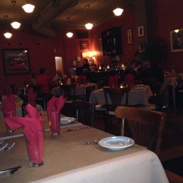 a dining room with tables and chairs a dining room with tables and chairs