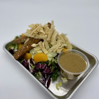 Alua's Thrive Bar - Mandarin Super Salad - Kale, Brussel Sprouts, Napa Cabbage, Mandarin Oranges, Cucumbers, Wonton Chips, w/ Spicy Ginger Dressing - Juice Bars & Smoothies Near Me - Mount Shasta, California Alua's Thrive Bar - Mandarin Super Salad - Kale, Brussel Sprouts, Napa Cabbage, Mandarin Oranges, Cucumbers, Wonton Chips, w/ Spicy Ginger Dressing - Juice Bars & Smoothies Near Me - Mount Shasta, California