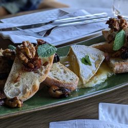 Vinya - Baked Brie (dried figs, walnuts, honey, mint, and brie on a hot playe) -- best I've ever had!