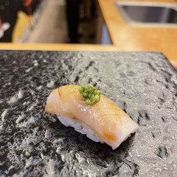 Kinzan Omakase - a close up of a piece of sushi - Sushi Bars Near Me - New York, New York Kinzan Omakase - a close up of a piece of sushi - Sushi Bars Near Me - New York, New York