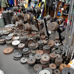 Play It Again Sports - Colerain - Used weights and snowboard behind