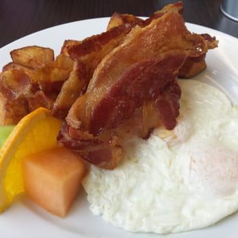 Blue Rooster - Weekday breakfast special is 2 eggs with bacon homefries and toast.  I opted out of the toast so they added some fruit. - Breakfast & Brunch Near Me - Ajax, Ontario