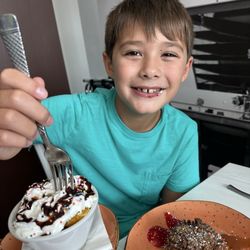 Maple - Fruit cup with whipped cream and cinnamon roll for his birthday!