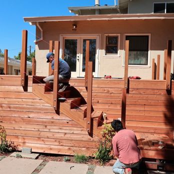 Oscito - two men working on a deck - Landscaping Near Me Oscito - two men working on a deck - Landscaping Near Me