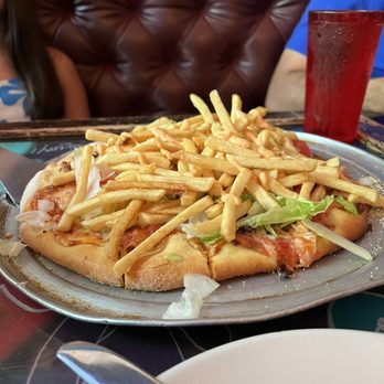 Gino's East - South Loop - Medium Thin-Burger & Fries - Pizza Near Me - Chicago, Illinois Gino's East - South Loop - Medium Thin-Burger & Fries - Pizza Near Me - Chicago, Illinois