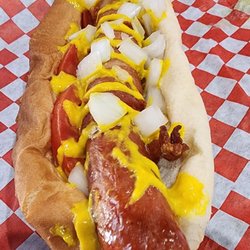 Boondoggies - Bacon wrapped dog with onion tomato mustard