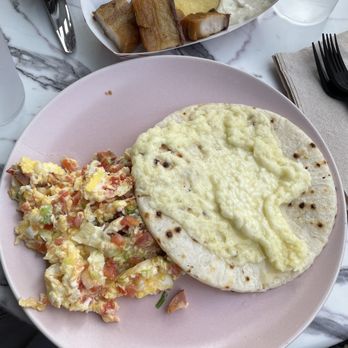 The Bakery Colombian Cafe - Eggs With Chorizo, Tomato, and Onions with cheese arepa - And Chicharons - Coffee & Tea Near Me - Orlando, Florida