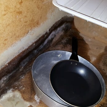 Nautical Motel - black mold in kitchen cabinet - Hotels Near Me - Hampton, New Hampshire