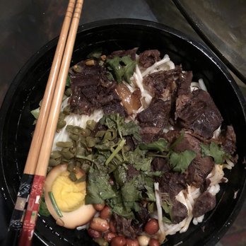 Jing 5 - a bowl of food with chopsticks - Chinese Near Me - Houston, Texas Jing 5 - a bowl of food with chopsticks - Chinese Near Me - Houston, Texas