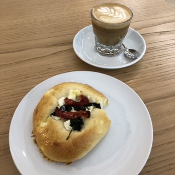 Newport Coffee House - Goat cheese, spinach and sun dried tomatoes brioche with a cortado. - Coffee & Tea Near Me - Evanston, Illinois