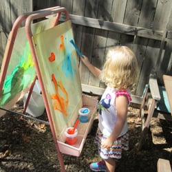 You Are My Sunshine Preschool - Painting outside is fun, too!