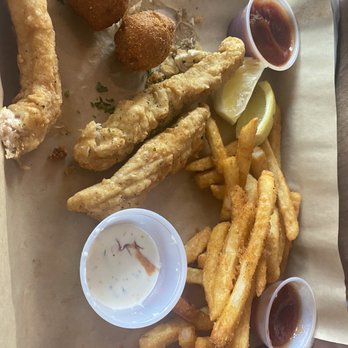 What The Crab - Partially eaten  chicken platter. The fries were delicious! - Seafood Near Me - Mansfield, Texas