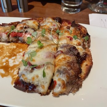 Guy Fieri's Kitchen + Bar - Flat bread appetizer - Steakhouses Near Me - Council Bluffs, Iowa Guy Fieri's Kitchen + Bar - Flat bread appetizer - Steakhouses Near Me - Council Bluffs, Iowa