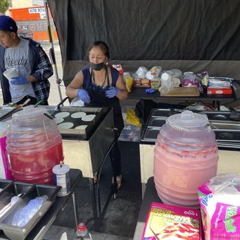 Firme Tacos - a woman preparing food at a stand - Mexican Near Me - Los Angeles, California Firme Tacos - a woman preparing food at a stand - Mexican Near Me - Los Angeles, California