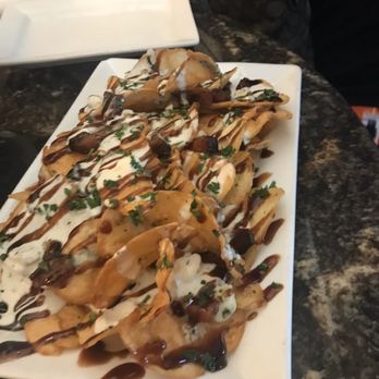 Green Door On 8th - Appetizer. Chips with blue cheese and balsamic drizzle. - New American Near Me - Dade City, Florida