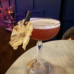 The Blue Room Speakeasy - Bartender made up. Pomegranate mezcal drink AMAZING