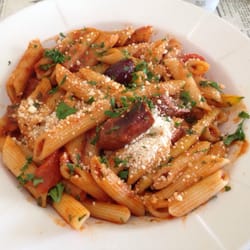 Merguez sausages and vegetables in tomato sauce penne