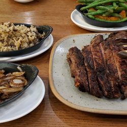 Chop Steakhouse & Bar - 32oz Bone-In Ribeye w sautéed onions, green beans and butternut squash, rice pilaf.