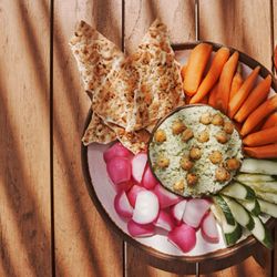 Edamame hummus is served at Tiki Bar with fresh veggies.