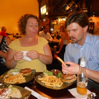 Green Door On Second - a man and a woman eating at a restaurant - Bars Near Me - Temple, Texas