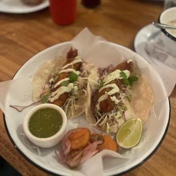 Dillon Beach Coastal Kitchen - baja fish tacos: beer battered rock cod, smashed avocado, cabbage, cilantro-lime crema, salsa verde = $20 - New American Near Me - Dillon Beach, California