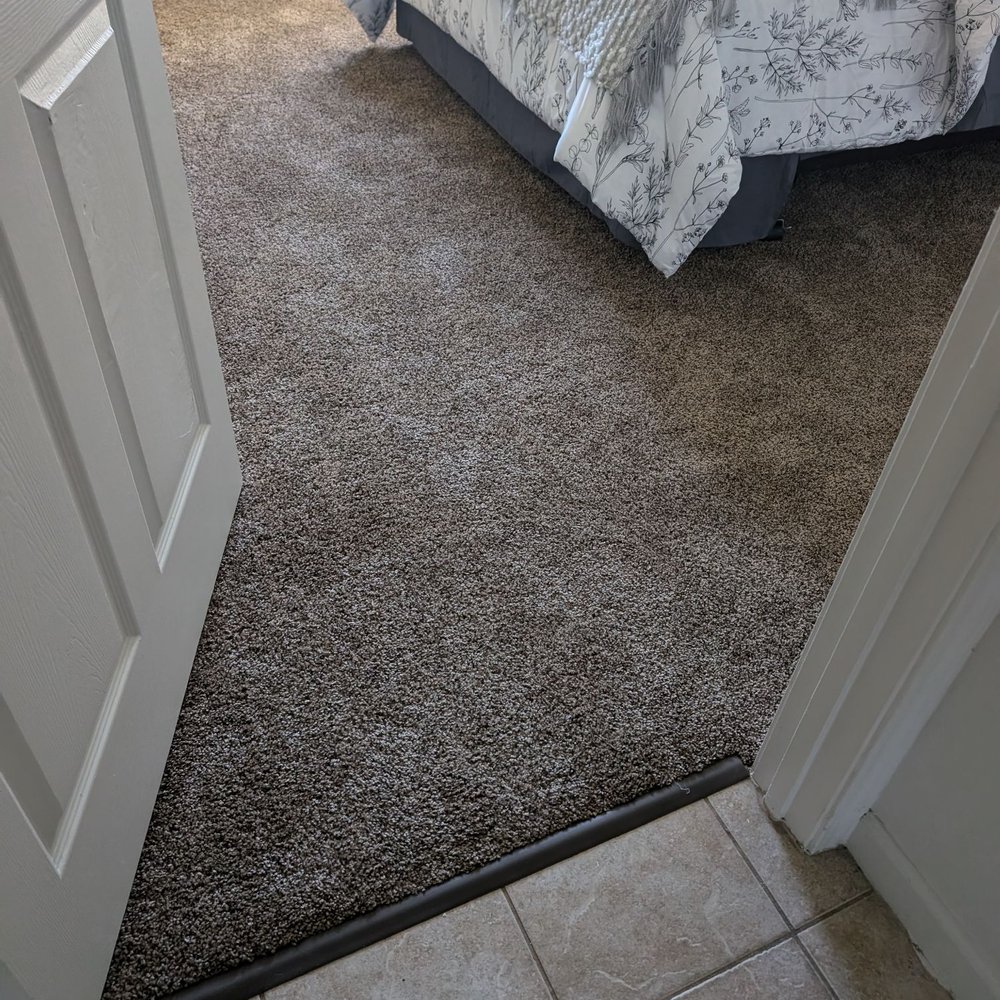 Kading Properties - A bedroom showing tile to carpet in the rooms - Property Management Near Me - Urbandale, Iowa Kading Properties - A bedroom showing tile to carpet in the rooms - Property Management Near Me - Urbandale, Iowa