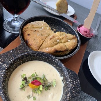 Latitudes - Jupiter Beach Resort - Focaccia with blueberry butter and cheese sauce for dipping--beyond decadent for two, and perfect to share with six. - Seafood Near Me - Jupiter, Florida