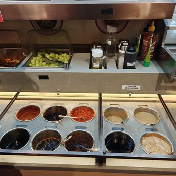 Shoo Loong Kan - Sauce station pic 1/2. Unlimited appetizers on the top. Seedless green grapes were really good, super juicy and sweet. - Hot Pot Near Me - Flushing, New York