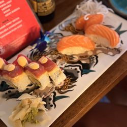 Outcast Sushi - Tsunami Roll, Salmon Nigiri, and Sashimi