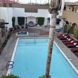 The spotless and charming pool area with jacuzzi and bar. The spotless and charming pool area with jacuzzi and bar.