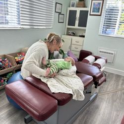 Ocean Wellness - Checking over the newest little guy and adjusting the big kids and mom too