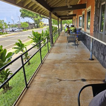 Kilauea Market + Cafe - A shaded lanai with outdoor seating - Grocery Near Me - Kilauea, Hawaii Kilauea Market + Cafe - A shaded lanai with outdoor seating - Grocery Near Me - Kilauea, Hawaii