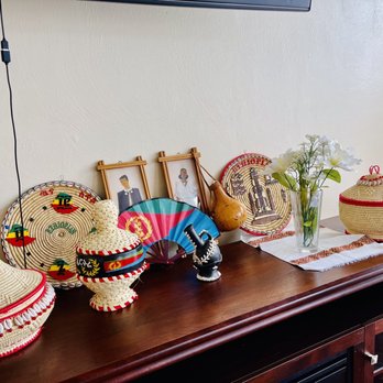 Mesob Cafe - a variety of hats on a table - Ethiopian Near Me - Virginia Beach, Virginia Mesob Cafe - a variety of hats on a table - Ethiopian Near Me - Virginia Beach, Virginia